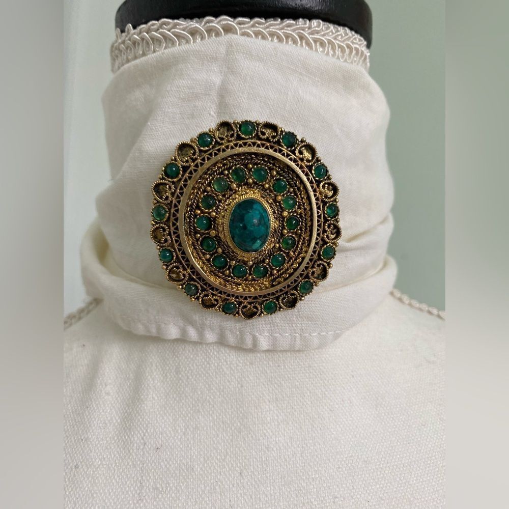 Golden Pendant and brooch with Emerald Green Stones